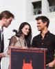 Robert Pattinson, Kristen Stewart and Taylor Lautner on stage at the TWILIGHT TRIO HANDPRINT AND FOOTPRINT CEREMONY | ©2011 Sue Schneider
