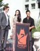 Kristen Stewart speak to the fans, while Robert Pattinson and Taylor Lautner listen at the TWILIGHT TRIO HANDPRINT AND FOOTPRINT CEREMONY | ©2011 Sue Schneider