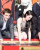 Robert Pattinson, Kristen Stewart and Taylor Lautner put their hands in the cement at the TWILIGHT TRIO HANDPRINT AND FOOTPRINT CEREMONY | ©2011 Sue Schneider