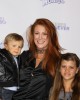 Angie Everhart and family at the Los Angeles Premiere of Justin Bieber: Never Say Never | © 2011 Sue Schneider