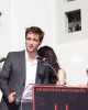 Robert Pattinson speaks to the fans at the TWILIGHT TRIO HANDPRINT AND FOOTPRINT CEREMONY | ©2011 Sue Schneider