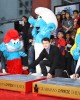 Anton Yelchin signs Clumsy's cement at THE SMURFS Hand and Footprint Ceremony | ©2011 Sue Schneider