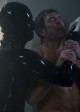 Dylan McDermott and Rubber Man in AMERICAN HORROR STORY - Season 1 - "Smoldering Children" | ©2011 FX/Lewis Jacobs