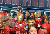 Robert Downey Jr. poses with fans at the Marvel Studios booth during Comic-Con 2012 in San Diego on July 14, 2012 | ©2012 Alberto E. Rodriguez/WireImage