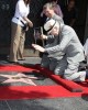 Walter Koenig bows to the star with Leron Gubler and Ana Martinez at the Hollywood Walk of Fame Ceremony for Walter Koenig | ©2012 Sue Schneider