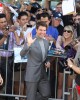 Tom Cruise waves to photographers as he comes back on the carpet At the American Premiere of OBLIVION | ©2013 Sue Schneider