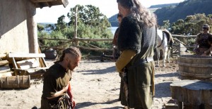 Ragnar (Travis Fimmel) bows before the Earl (Gabriel Byrne) in VIKINGS "Raid" | (c) 2013 History/Jonathan Hession