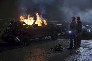 Dean (Jensen Ackles) and Sam (Jared Padalecki) burn a car in hopes of stopping a ghost in SUPERNATURAL | © 2015 Katie Yu/The CW