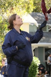 Brennan (Emily Deschanel) examines remains at a crime scene in the season finale of Bones | © 2015 Patrick McElhenney/FOX