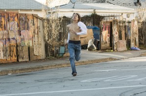 Nick (Frank Dillane) runs from a church full of zombies in FEAR THE WALKING DEAD | © 2015 Justin Lubin/AMC