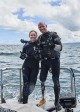 Ronda Rousey and Paul De Gelder pose before their dive beneath the waters off the Fiji coast in RHONDA ROUSEY UNCAGED | ©2018 Discovery Channel