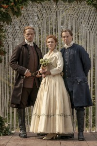 Sophie Skelton as Brianna Randall, Sam Heughan as Jamie Fraser and Richard Rankin as Roger Wakefield in OUTLANDER - Season 5 | ©2020 Starz