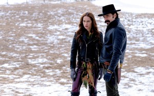 Melanie Scrofano as Wynonna Earp, Tim Rozon as Doc Holliday in WYNONNA EARP - Season 4 - "Hell Raisin' Good Time" | ©2021 Syfy/Michelle Faye/Wynonna Earp Productions, Inc