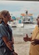 Mariana van Zeller (L) interviews the owner of a boating company that shuttles migrants from Necoclí, Colombia to the Darién Gap in TRAFFICKED WITH MARIANA VAN ZELLER | ©2023 National Geographic