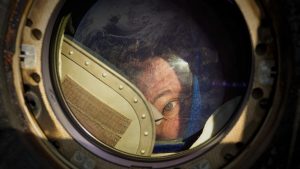 Expedition 27 Flight Engineer Cady Coleman peeks out of a window of the Soyuz TMA-20 spacecraft shortly after she and Commander Dmitry Kondratyev and Flight Engineer Paolo Nespoli landed southeast of the town of Zhezkazgan, Kazakhstan in SPACE: THE LONGEST GOODBYE | © 2024 PBS