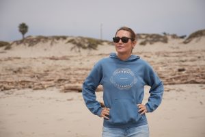 Kinga Philipps on the sand in SHARK WEEK: WHAT SHARK ATTACKED | ©2026 Discovery Channel